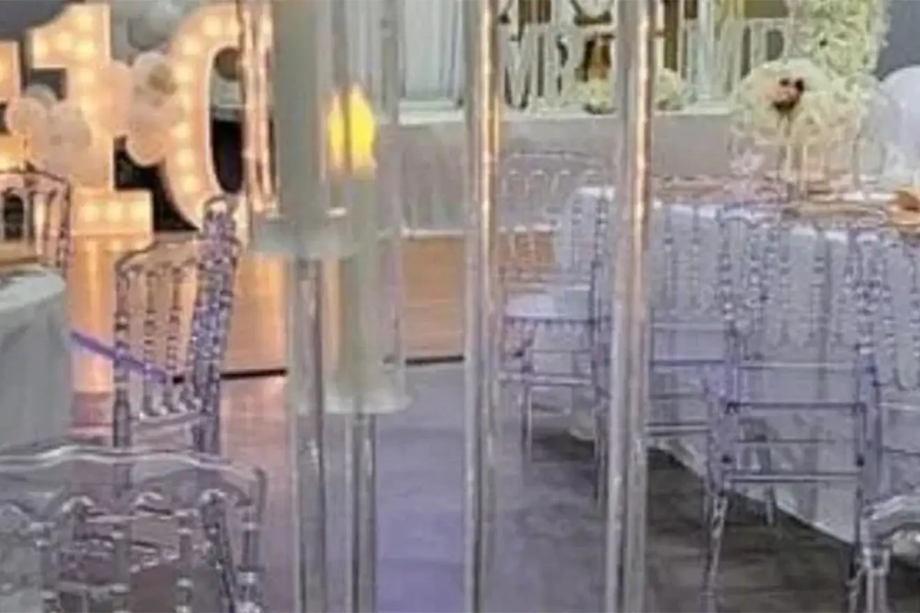 A room with clear chairs and tables in it