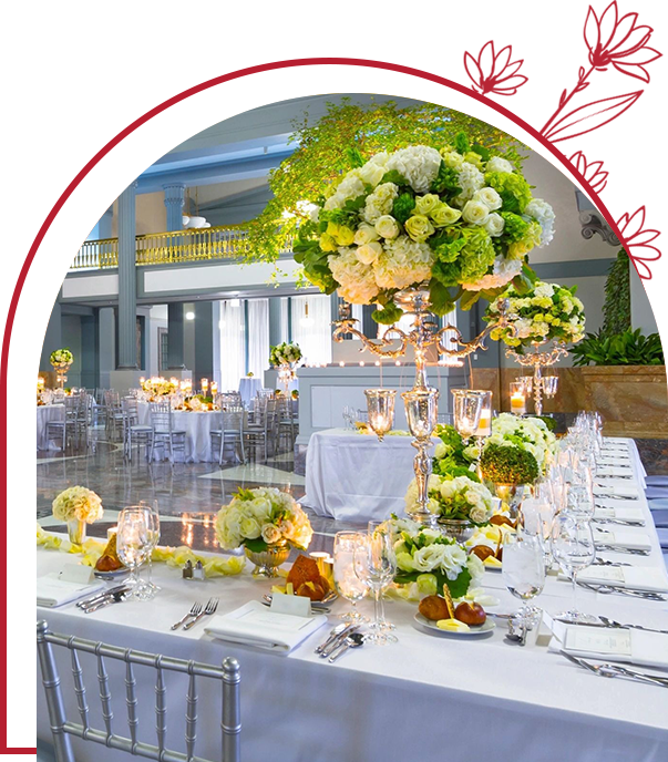 A table set up with flowers and candles.